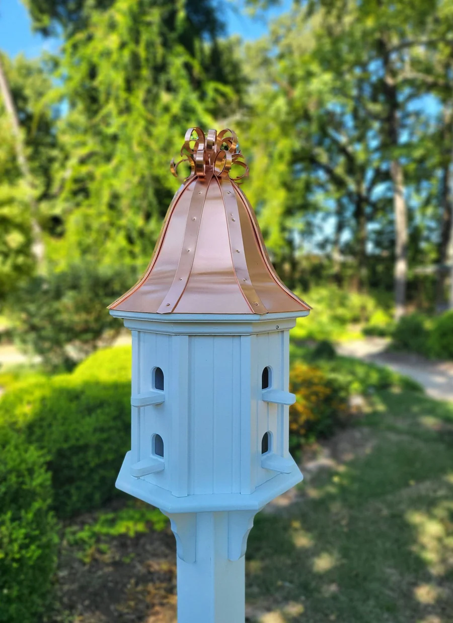 Handmade birdhouse with a copper roof, featuring 8 nesting compartments and a durable outdoor design, perfect for attracting birds to your garden.