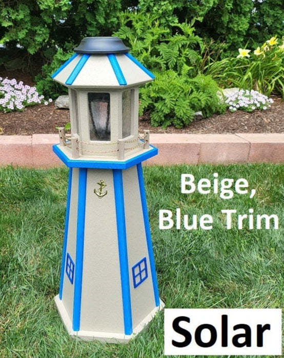 May include: Beige solar powered lighthouse with blue trim. The lighthouse has a gold anchor on the front. The text 'Beige, Blue Trim' and 'Solar' is visible below the lighthouse.