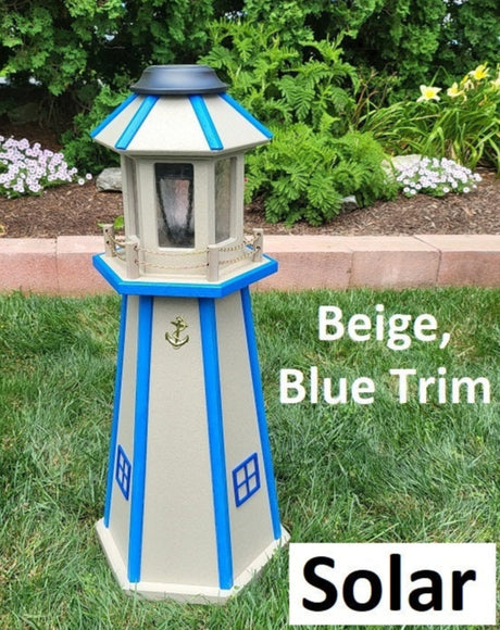 May include: Beige solar powered lighthouse with blue trim. The lighthouse has a gold anchor on the front. The text 'Beige, Blue Trim' and 'Solar' is visible below the lighthouse.