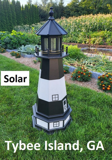 May include: A black and white lighthouse with a solar panel on top. The lighthouse is standing on a green lawn with a garden in the background. The text 'Solar' is visible on the left side of the image. The text 'Tybee Island, GA' is visible at the bottom of the image.