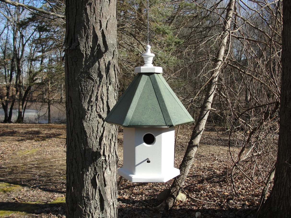 Handmade wooden hanging birdhouse featuring a single nesting compartment, aluminum roof, and vinyl-coated hanging wire for easy installation.