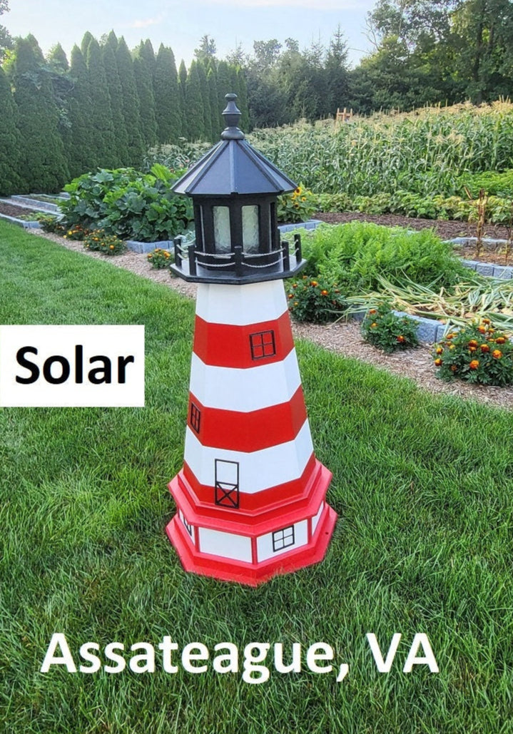 May include: A red and white striped lighthouse with a black roof and a solar panel on top. The lighthouse is on a green lawn with the words &#39;Solar&#39; and &#39;Assateague, VA&#39; printed below it.