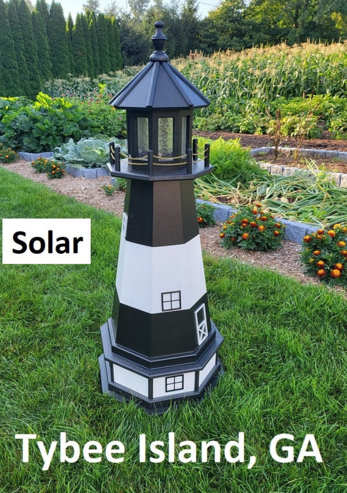 May include: A black and white lighthouse with a solar panel on top. The lighthouse is standing on a green lawn with a garden in the background. The text &#39;Solar&#39; is visible on the left side of the image. The text &#39;Tybee Island, GA&#39; is visible at the bottom of the image.