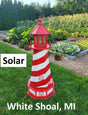 May include: A red and white striped lighthouse with a solar light. The lighthouse is in a garden setting with green grass and plants. The text &#39;Solar&#39; and &#39;White Shoal, MI&#39; are visible in the image.