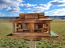 Load image into Gallery viewer, Log Cabin Bird Feeder Amish Handmade, Country Store Design, Multi Colors, Optional Custom Sign, Made of Pine With Cedar Roof - Unique Feeders / Houses
